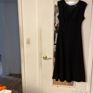 Black A-line dress made of 100% polyester.
